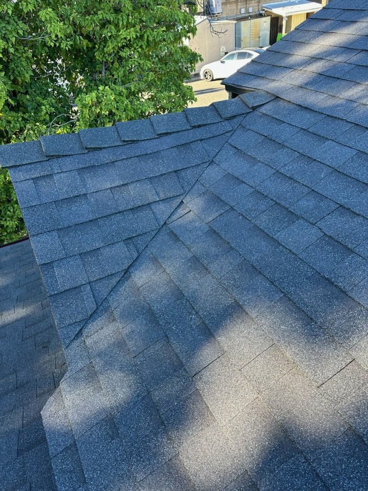 Slide of Zaguilan Roofing Service