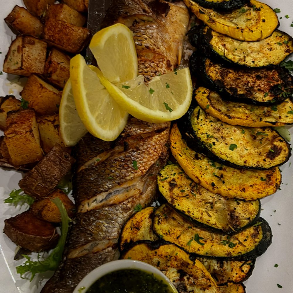 Rosario's Italian Kitchen - Whole Branzino with veggies - Italian Near Me - Baltimore, Maryland Rosario's Italian Kitchen - Whole Branzino with veggies - Italian Near Me - Baltimore, Maryland