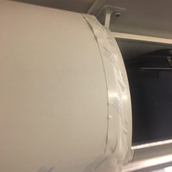 American Airlines - Storage area held up with tape