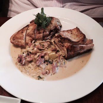 Mallams At The Quay - Chicken breast stuffed with mushrooms & served with a savoury bread pudding and leeks with pancetta - British Near Me - Weymouth, DOR