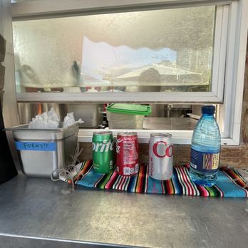 Tacos De Cacheton - a taco stand with a bottle of water - Tacos Near Me - Honolulu, Hawaii