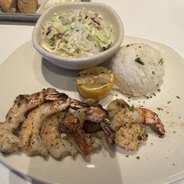 Scallops, shrimp with rice and coleslaw.