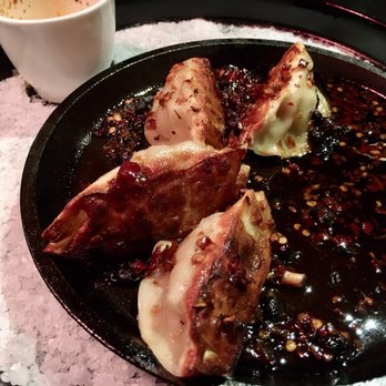 P.F. Chang's - Pan Fried Pork Dumplings on a sizzling platter with "special sauce" poured over the dumplings table side - SO GOOD! - Chinese Near Me - Fairfax, Virginia P.F. Chang's - Pan Fried Pork Dumplings on a sizzling platter with "special sauce" poured over the dumplings table side - SO GOOD! - Chinese Near Me - Fairfax, Virginia