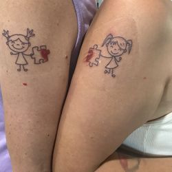 The sister tattoos together the puzzle piece make a heart