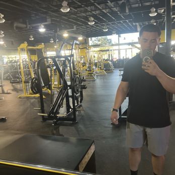 Fitnation Gym - View of half the gym from the far back side mirror down the center. - Gyms Near Me - Ontario, California Fitnation Gym - View of half the gym from the far back side mirror down the center. - Gyms Near Me - Ontario, California