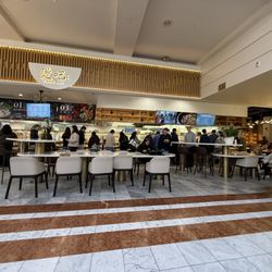 Tang Bar - Customers at the bar picking food items