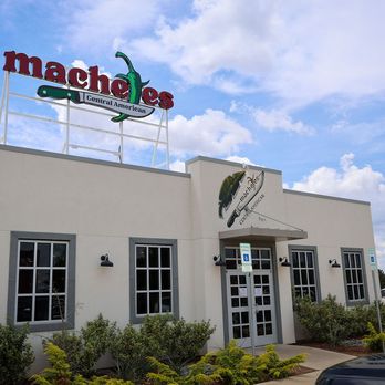 Machetes Central American - Front, outside of restaurant, showing front door and sign - Mexican Near Me - Edmond, Oklahoma