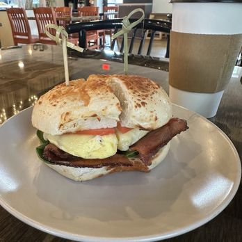 MoonWink's Cafe - Sammy's best on asiago bagel (egg, bacon, swiss, spinach, tomato, and garlic aioli) - Coffee & Tea Near Me - Ann Arbor, Michigan