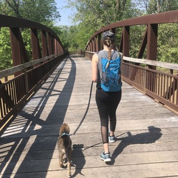 Prairie Oaks Metro Park - Girl walking puppy on bridge - Hiking Near Me - Hilliard, Ohio