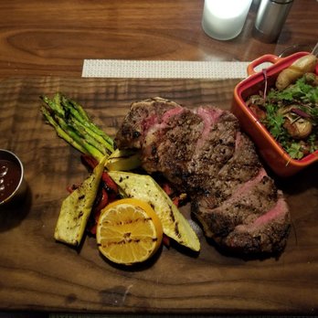 District - prime rib strip loin with roasted vegetables and small potatoes - Cocktail Bars Near Me - Los Angeles, California District - prime rib strip loin with roasted vegetables and small potatoes - Cocktail Bars Near Me - Los Angeles, California