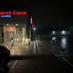 Rockbrook Urgent Care - Empty lot with two cars