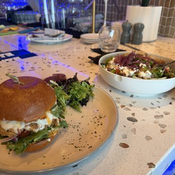 Crudo - Crab cake burger and La Greek Salad - Latin American Near Me - Palm Springs, California Crudo - Crab cake burger and La Greek Salad - Latin American Near Me - Palm Springs, California