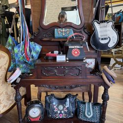 Nannette Keller - A purse that is a beautiful antique clock that actually works if you add a battery and an electric guitar! I