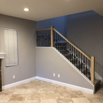 Remcon Design Build - Custom stair railing with Iron rods and poplar handrail. - General Contractors Near Me - San Diego, California