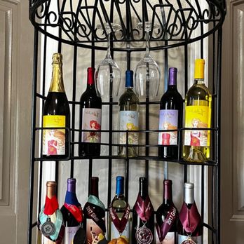 Valle Della Pace Vineyards & Winery - a wine rack with wine bottles and cheese - Wineries Near Me - Garden Valley, Texas Valle Della Pace Vineyards & Winery - a wine rack with wine bottles and cheese - Wineries Near Me - Garden Valley, Texas