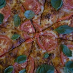 The famous and most deeeelicious Margherita Pizza The famous and most deeeelicious Margherita Pizza