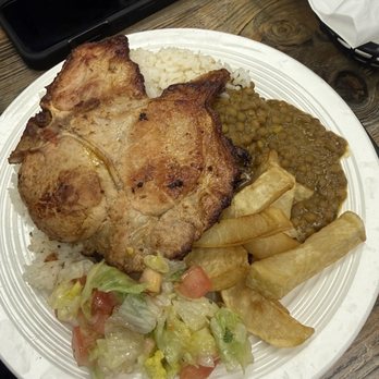 Los Andes Restaurant & Bar - Pork Chop/Chuleta with rice, lentils, french fries, and salad - Empanadas Near Me - Stony Point, New York Los Andes Restaurant & Bar - Pork Chop/Chuleta with rice, lentils, french fries, and salad - Empanadas Near Me - Stony Point, New York
