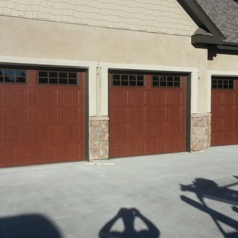 Doors In Motion - 3 Walnut 8x8's model# 3630 - Garage Door Services Near Me