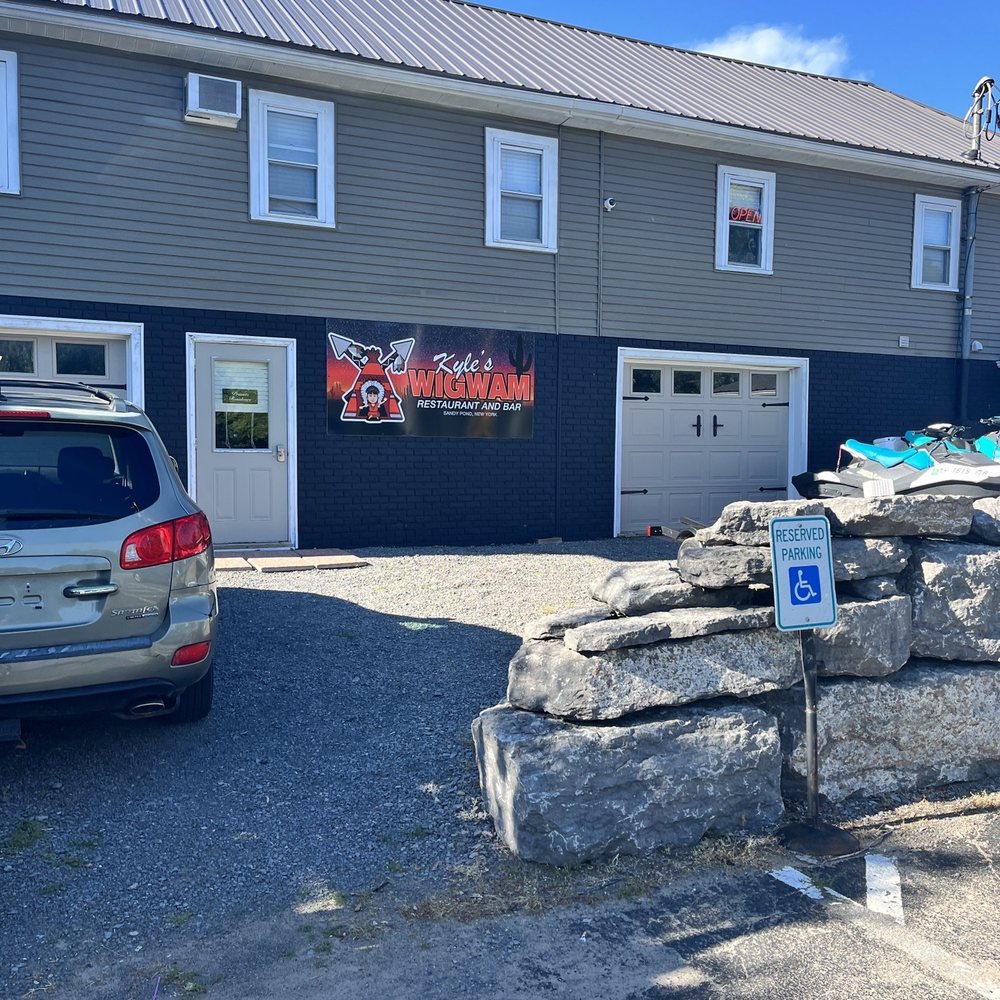 Kyle's Wigwam - a car parked in front of a building - Cocktail Bars Near Me - Pulaski, New York Kyle's Wigwam - a car parked in front of a building - Cocktail Bars Near Me - Pulaski, New York