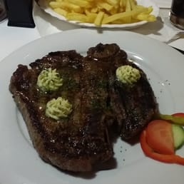 T-bone steak cooked medium well. T-bone steak cooked medium well.