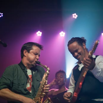 The Elbow - a man playing a saxophone and another man playing a guitar - Bars Near Me - Jacksonville, Florida The Elbow - a man playing a saxophone and another man playing a guitar - Bars Near Me - Jacksonville, Florida