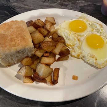 Buffa's Bar & Restaurant - Two eggs Sunny side up with biscuit and potatoes - Burgers Near Me - New Orleans, Louisiana