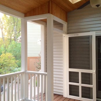Avec Construction - a screened porch with a ceiling fan - General Contractors Near Me