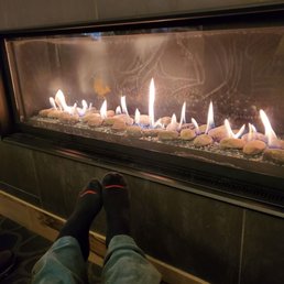 Relax by hot fire in lobby while waiting for room. Relax by hot fire in lobby while waiting for room.