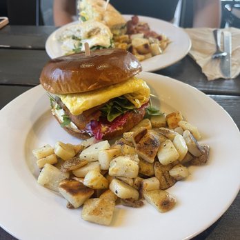 Bloom Coffee & Kitchen - Breakfast Sando (with the BLET breakfast sandwich in the back) - Coffee & Tea Near Me - Roseville, California