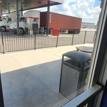TA Travel Center - Small smoking area patio outside for drivers who want to sit outside easy access back in from the driver's lounge - Gas Stations Near Me - Register, Georgia TA Travel Center - Small smoking area patio outside for drivers who want to sit outside easy access back in from the driver's lounge - Gas Stations Near Me - Register, Georgia
