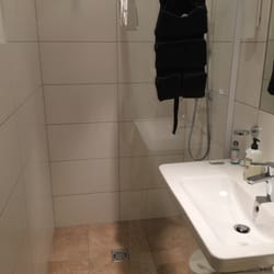 Ferienhof Gassner - Shower and toilet okay but shower has no door or hooks for clothes so floor can get wet and so can clothes if leave on floor