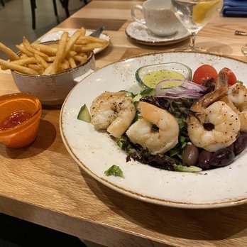 Table 55 - Greek salad with shrimp & fries - New American Near Me - Miami, Florida