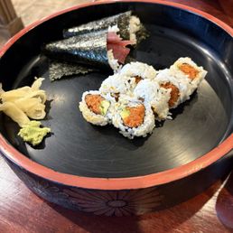 Spicy tuna roll and two tuna hand rolls Spicy tuna roll and two tuna hand rolls