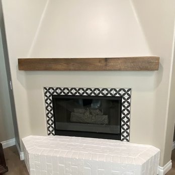 RG Construction - a fireplace in a living room - General Contractors Near Me