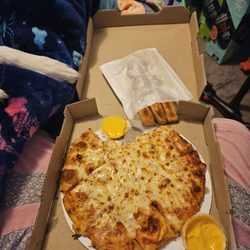 Pizza King - Extra Cheese 10in pizza with bread sticks and side cheese cup. 2 pieces already eaten at this point