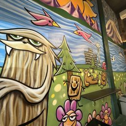 Mural on the wall behind the bar seating
