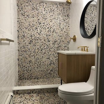 MJ Renovations - a bathroom with a shower, toilet and sink - General Contractors Near Me