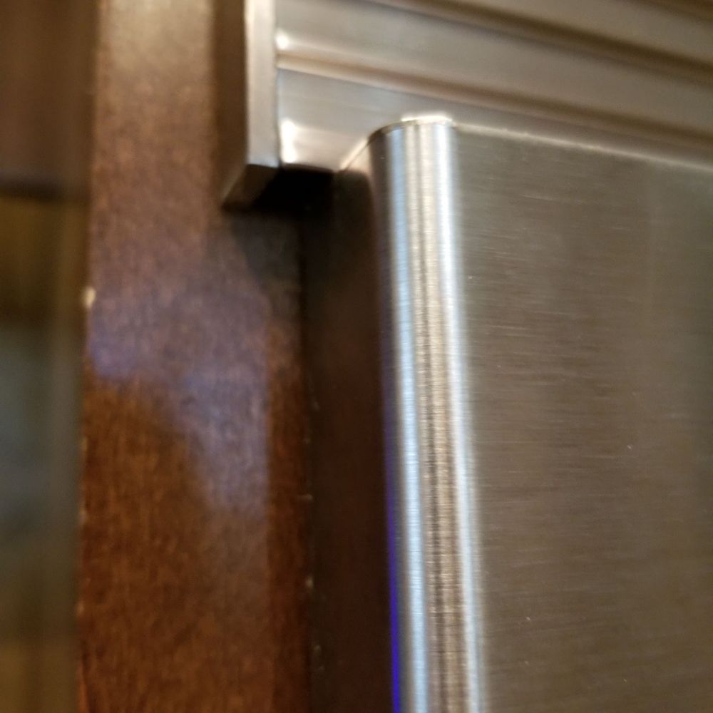 Rikman Services - LEFT SIDE OF "SPECIAL ORDERED TRIM KIT" HANGING OVER OVEN FRAME.  "SPECIAL ORDERED TRIM KIT" WAY TOO LARGE. - Electricians Near Me - Conroe, Texas
