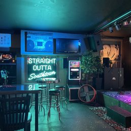 a bar with neon signs