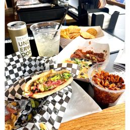 Elderflower Spritz, Charlie Brown sandwich, deconstructed nachos and bar peanuts Elderflower Spritz, Charlie Brown sandwich, deconstructed nachos and bar peanuts