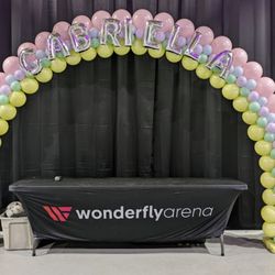 Pastel balloon arch with name personalization for a Bat Mitzvah at Wonderfly Arena in Timonium, MD. Soft, sweet, and photo-ready decor.