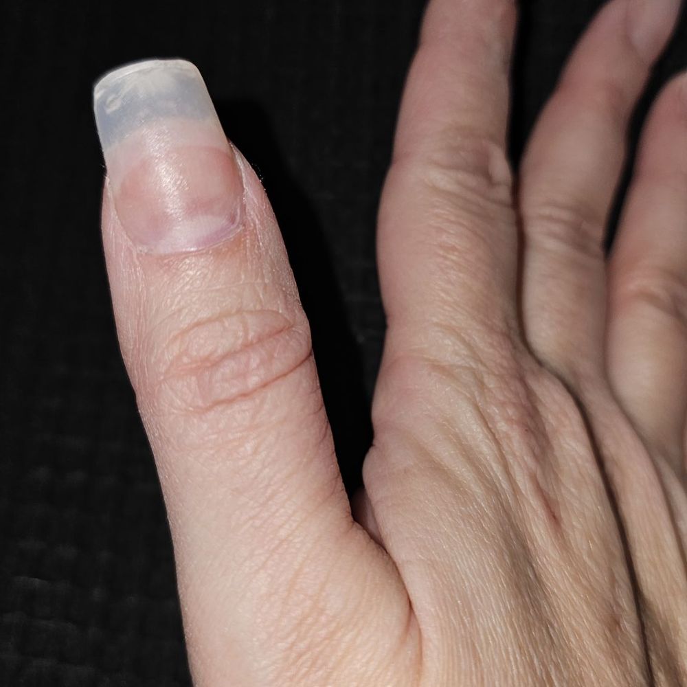 Evian Spa - Had to cut my own thumbnail down when they used the wrong nail - Nail Salons Near Me - Selden, New York