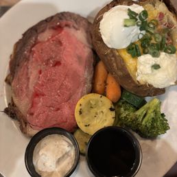 Yummy Prime rib! Cooked perfectly and the baked potatoes with cheese and bacon and sour cream was to die for! Yummy Prime rib! Cooked perfectly and the baked potatoes with cheese and bacon and sour cream was to die for!