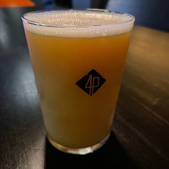 Four Points Brewing - a glass of beer on a table - Breweries Near Me - Pittsburgh, Pennsylvania