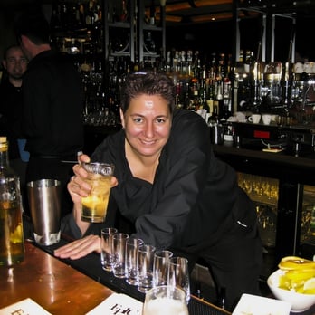 EPIC Steak - Becky the Bartender pours one of many shots - Steakhouses Near Me - San Francisco, California EPIC Steak - Becky the Bartender pours one of many shots - Steakhouses Near Me - San Francisco, California