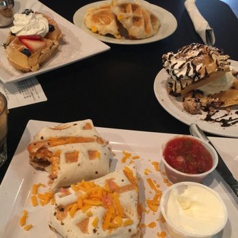 Just Love Coffee Cafe - Murfreesboro West - Berry waffle (top left) sausage biscuit( top right) chocolate chip cookie dough waffle( right corner) breakfast burrito ( bottom) - Coffee & Tea Near Me - Murfreesboro, Tennessee