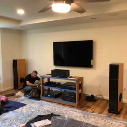 Quicksilver Audio - Guys from Quicksilver installing TV.