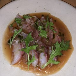 Sea bream with tomato dashi and jalapeños