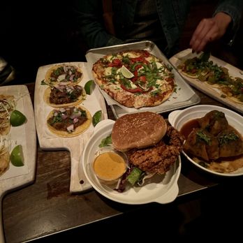 East Bay Spice - Full spread. Lamb tacos, vegetarian tacos, prawn tacos, flatbread, & fried chicken sandwhich - Indian Near Me - Berkeley, California East Bay Spice - Full spread. Lamb tacos, vegetarian tacos, prawn tacos, flatbread, & fried chicken sandwhich - Indian Near Me - Berkeley, California