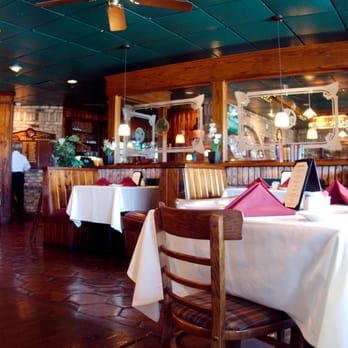 Atlantis Grill & Bar - The decor is warm and inviting. - American Near Me - Lake Worth, Florida Atlantis Grill & Bar - The decor is warm and inviting. - American Near Me - Lake Worth, Florida